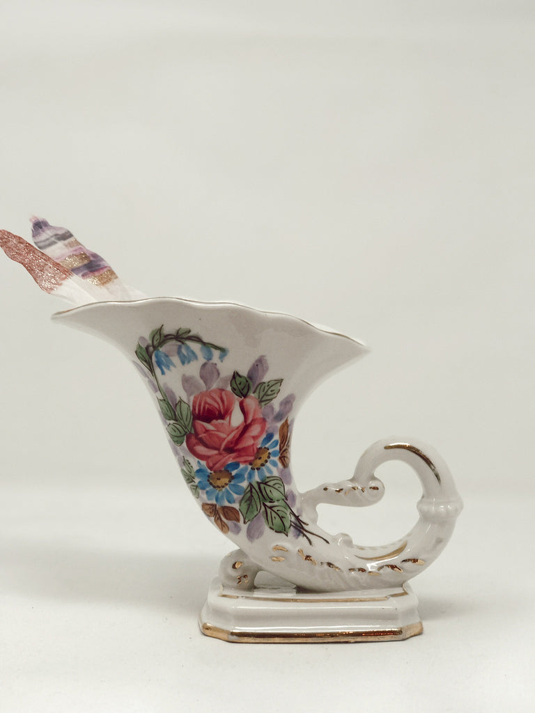 Small curved porcelain vase